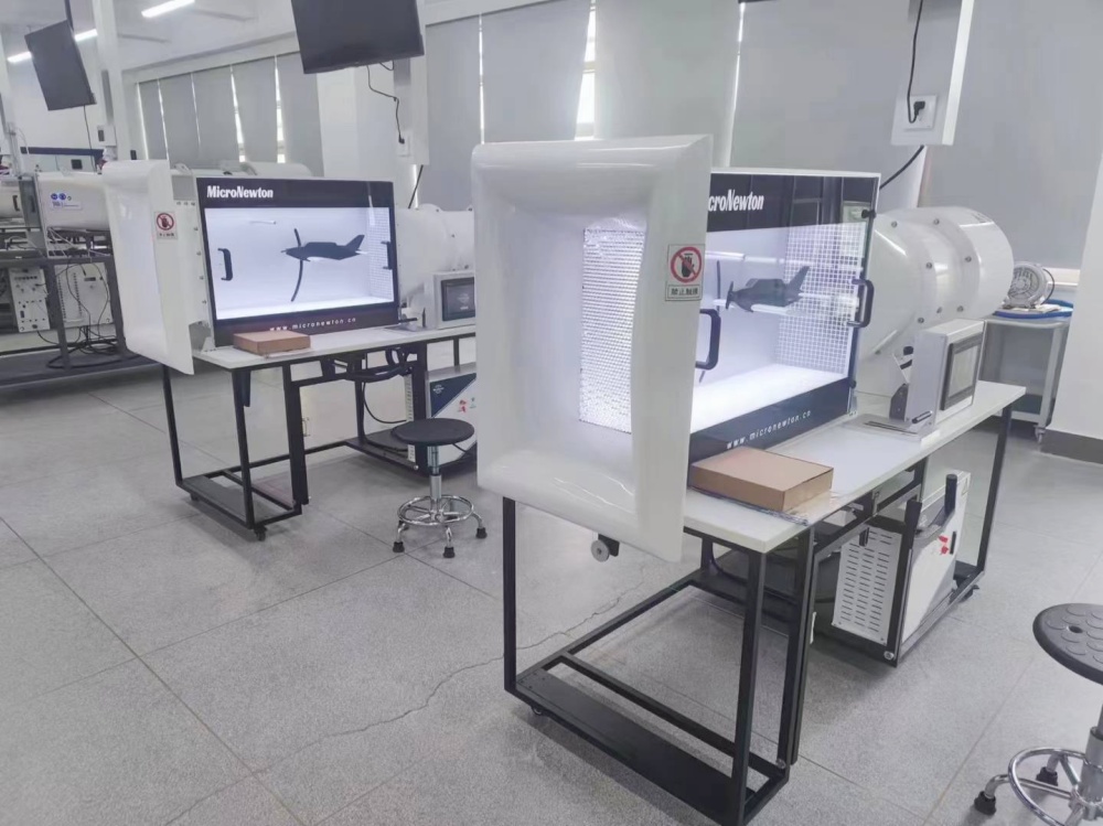 NACA 2412 wing model with tuft wires inside the transparent wind tunnel test section